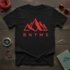 Black t-shirt featuring a red abstract mountain range logo above the text BNTMS, representing adventure and exploration