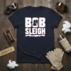 Bob Sleigh graphic t-shirt with bold white text and snow accents, featuring a silhouette of people sledding