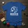 Bocce The Sport Of Kings t-shirt design with white text and graphic of a player throwing a bocce ball