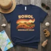 Retro t-shirt design featuring "BOHOL CHOCOLATE HILLS" text with a stylized sunset over rolling hills and palm trees