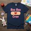 Boo Boo Crew t-shirt with pink text and a band-aid graphic featuring a smiling heart