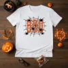 White t-shirt with "BOO" in orange text on a black spider web, surrounded by small black spiders