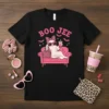 Black t-shirt featuring the phrase "Boo Jee" in pink text above a cute ghost lounging on a pink couch, holding