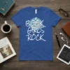 Blue t-shirt with white text "BOOK GIRLS ROCK" and stack of books graphic