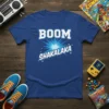 Boom Shakalaka text design on a blue t-shirt with a retro graphic burst and stars