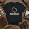 BOOMERANG text with circular graphic of orange and teal boomerangs on a navy t-shirt