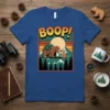 BOOP! text with a bear and chipmunk in a mountain landscape, on a blue t-shirt