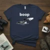 Navy blue t-shirt with white text "boop" above a loon bird being booped by a finger graphic