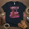 Boots on the Ground t-shirt design with cowboy boots, pink clouds, mountains, and moon graphic