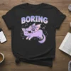 Black t-shirt with "BORING" text and a cute purple cat with bat wings and an eyepatch, music notes, and stars