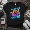 Born in the 80's but the 90's made me text with retro arcade and boombox graphics on a black t-shirt