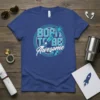 Born to Be Awesome text with a rocket launching through a circular graphic on a blue t-shirt