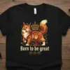 Born to be great text with a majestic orange cat wearing a crown graphic on a black t-shirt