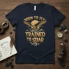 Born to Fly Trained to Soar text with a golden eagle graphic and mountain silhouette on a navy t-shirt