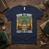 Born to Hunt Forced to Go to School t-shirt featuring a deer wearing a graduation cap and holding a pencil