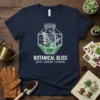 Botanical Bliss Grow Nurture Flourish quote on a navy t-shirt featuring a terrarium design