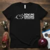 White text "Bowling Dreams Wind Blown Strikes" with a bowling ball graphic on a black t-shirt