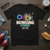 Black t-shirt with "BOWLING STRIKE EST. 1999 PERFECT GAME" text and a colorful bowling strike graphic