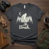 Brah. Bigfoot t-shirt design with a silhouette of Bigfoot walking through a forest under a crescent moon and stars
