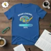 Blue t-shirt with "Brain Loading 50%" text, a cartoon brain filled with colorful cubes, and a progress bar
