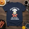 T-shirt with "Breakfast Is King Fuel The Day Fear No Hunger" text and a skull chef graphic with bacon