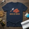 Brick By Brick t-shirt with graphic of trowel and bricks, construction theme, navy blue shirt