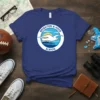 Brighton & Hove Albion t-shirt with a circular graphic of a seagull flying over a pier at sunset