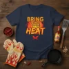 Bring the Heat text with chili peppers and fiery background on a navy t-shirt design