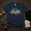 Navy blue t-shirt featuring a stylized yellow and blue Broadway skyline graphic
