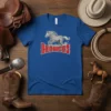 Blue t-shirt with a grey galloping horse and "BRONCOS" text in red and white, representing western rodeo fan apparel