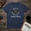 Brooklyn T Factory t-shirt with a winged gear logo and white text
