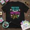 Brother-In-Law Of The Birthday Girl text with colorful balloons and gift graphics on a black t-shirt