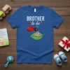 Brother To Be t-shirt with a white text design and a cute ladybug graphic, announcing a new sibling