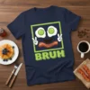 Bruh t-shirt design featuring a funny cartoon face made of fried eggs and bacon, with the word BRUH in bold