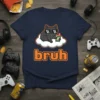 Navy t-shirt featuring the word "bruh" in pixelated orange font with a black cat wearing sunglasses on a cloud above