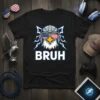 Black t-shirt with "BRUH" text and a cartoon eagle wearing aviator sunglasses with American flag lenses and headphones