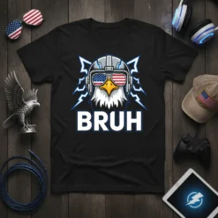 Black t-shirt with "BRUH" text and a cartoon eagle wearing aviator sunglasses with American flag lenses and headphones