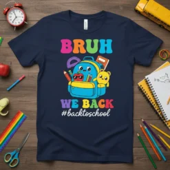 Bruh We Back #backtoschool text with a cute backpack, apple, and teddy bear graphic on a navy t-shirt
