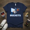 Navy t-shirt with pixelated "BUCKETS" text and a basketball going through a hoop with game icons and coins