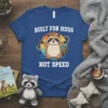 Built For Hugs Not Speed text with a cute, smiling raccoon graphic on a blue t-shirt