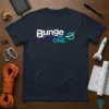 Bunge ONE. text logo on a dark navy t-shirt, featuring a purple rope graphic and teal accents