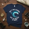 But It Was Assigned Gulf Of Mexico At Birth text design with a wave graphic on a navy blue t-shirt