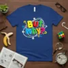 But Why? text design with colorful letters, question marks, and lightbulbs on a blue t-shirt