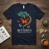 Navy t-shirt featuring the text "BUTTERFLY METAMORPHOSIS & GRACE" with colorful butterfly graphics and a chrysalis