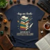 Buy Me Books and Tell Me to STFUATTDLAGG text with stack of books graphic on navy t-shirt