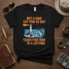 T-shirt with orange text "Buy A Man Eat Fish He Day Teach Fish Man To A Lifetime" featuring a lighthouse