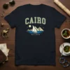 Cairo Nile River t-shirt design featuring pyramids, a sailboat on water, and the text "Cairo" and "Nile River"