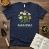 Calendula t-shirt with botanical illustration of the flower and text "Calendula A single bloom with graceful petals"