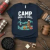 Navy t-shirt with white text CAMP GRILL & CHILL, featuring a cartoon bear grilling by a campfire in a forest