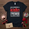 T-shirt with white text "CAN I BORROW A KISS? I PROMISE I'LL GIVE IT BACK" and red kiss graphic